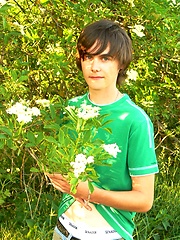 Boy with long hairs outdoor posing