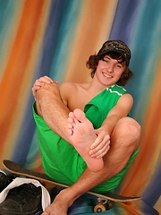 Cute skater teen boy with long hairs
