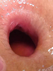 Asian boy putting fresh vegetable into own anal hole